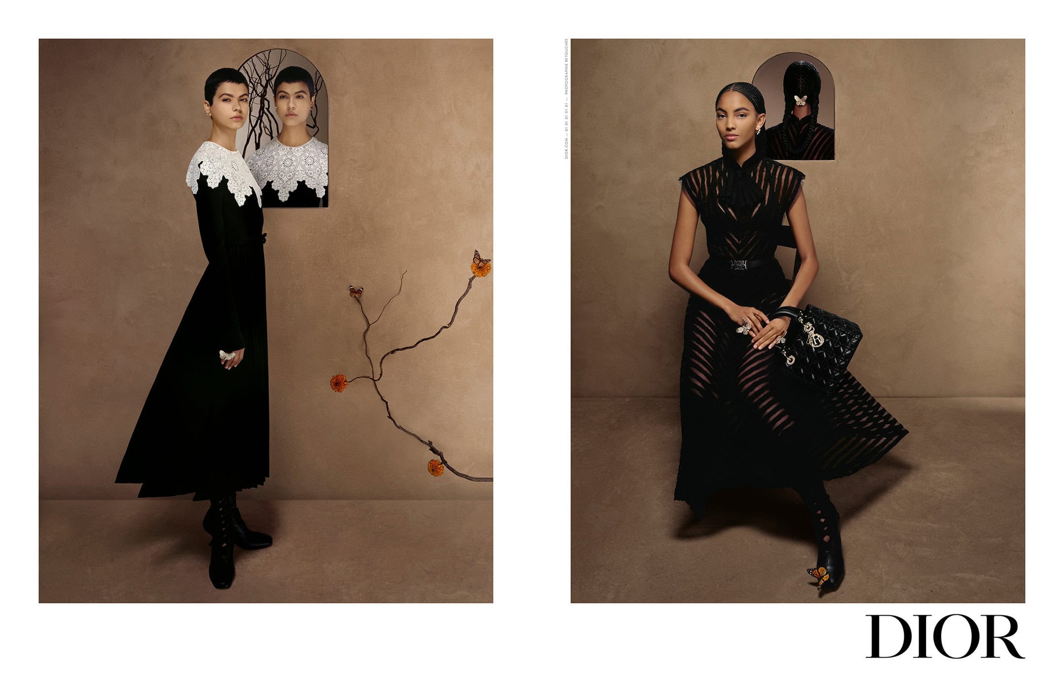Two dark-haired women pose in dark gowns with lace collars in a fashion advertisement. One holds a purse in front of a tan wall.