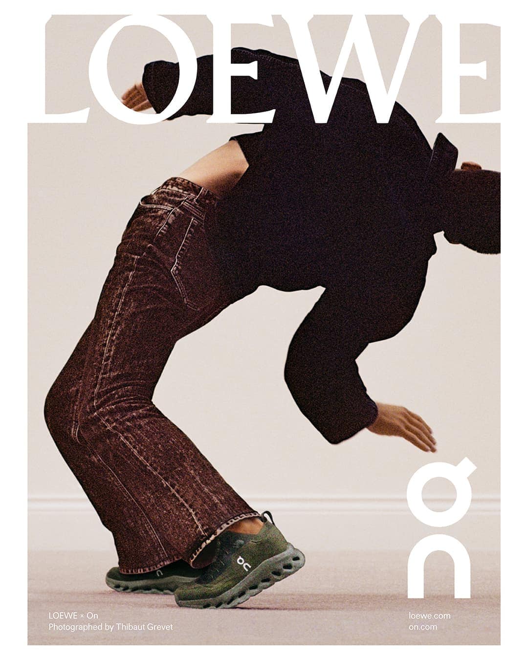 Fashion editorial shot of a model arching backwards in a black top, brown jeans, and green sneakers with Loewe and On logos.