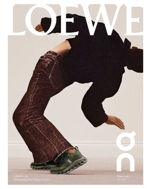 Fashion editorial shot of a model arching backwards in a black top, brown jeans, and green sneakers with Loewe and On logos.