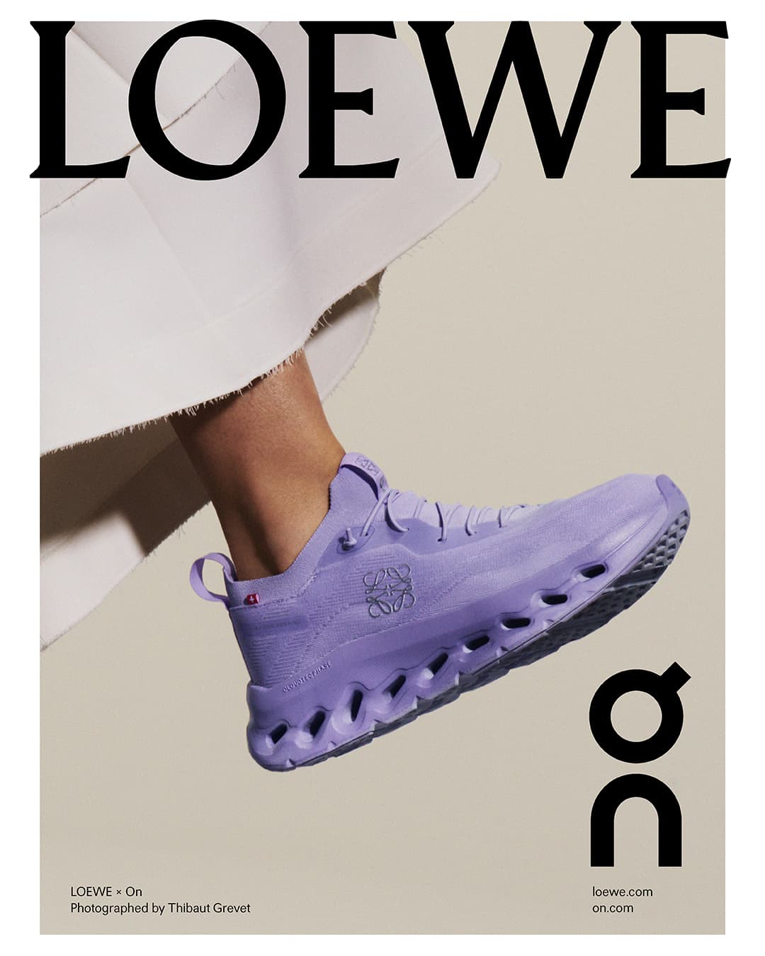Loewe x On collaboration shoe in lilac, showcased in a studio setting with a glimpse of a garment, emphasizing fashion and design.