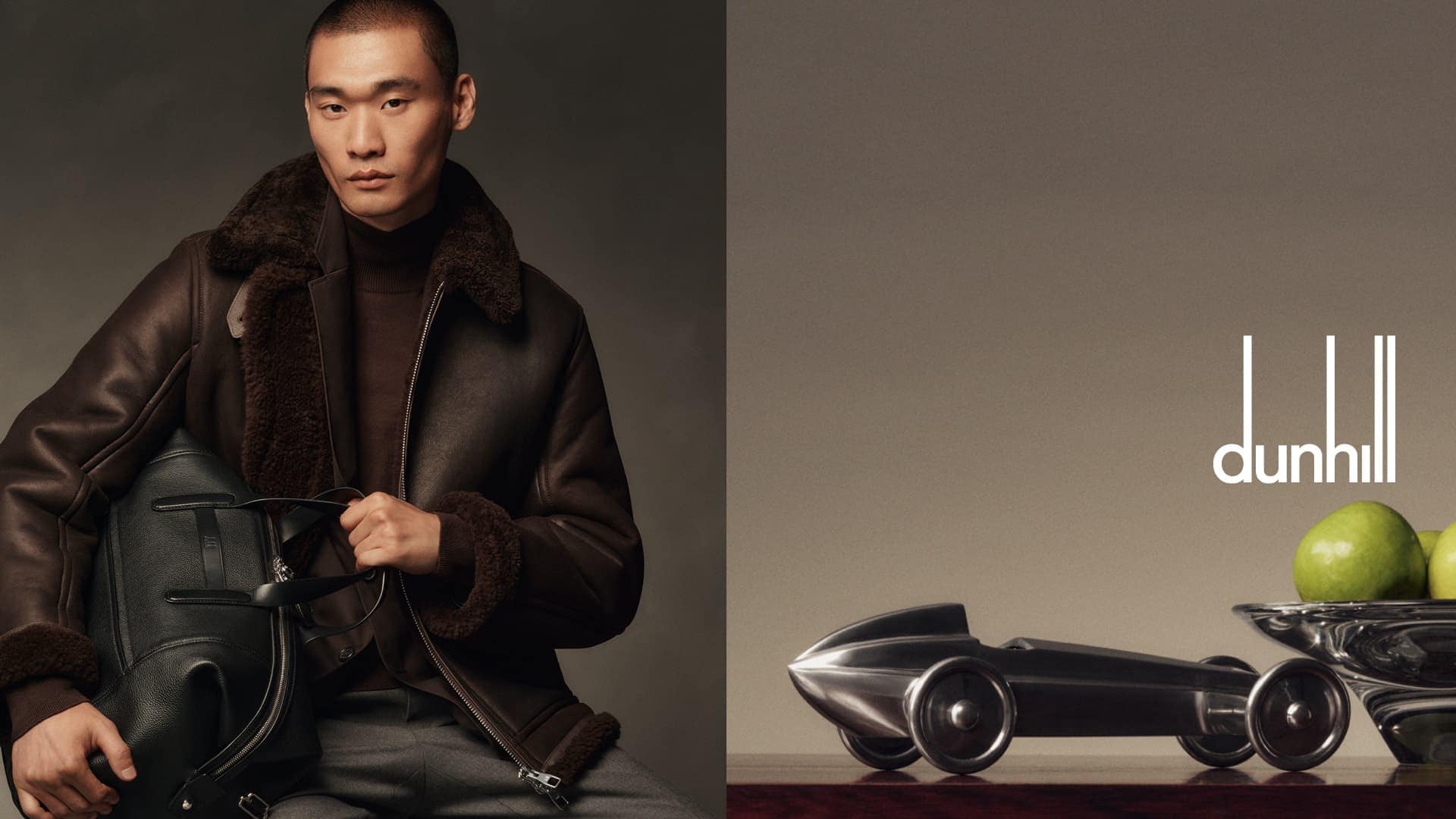 Asian man poses in shearling jacket, holding black leather backpack in a studio shot for Dunhill advert with lime and metal car.