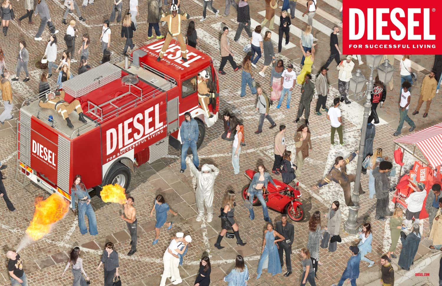 Diesel fashion advertisement featuring a large group of people with a red fire truck in a cobblestone street, Diesel logo visible.