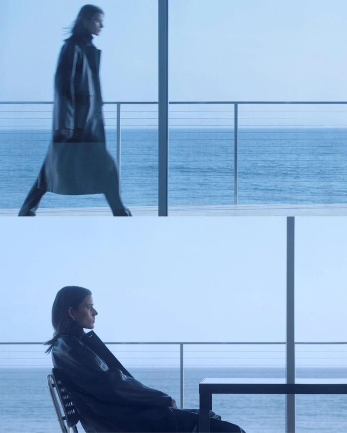 Model Vivienne Rohner in a dark coat by the ocean for Toteme Fall 2023 ad campaign, photographed by Zoë Ghertner.