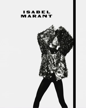 Monochrome fashion campaign image featuring Irina Shayk wearing a textured sparkly top and dark pants against a white background.