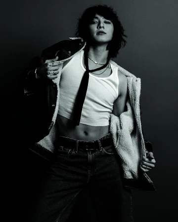 Jung Kook in a white tank top and denim jacket for Calvin Klein Fall 2023 ad campaign by Inez and Vinoodh.