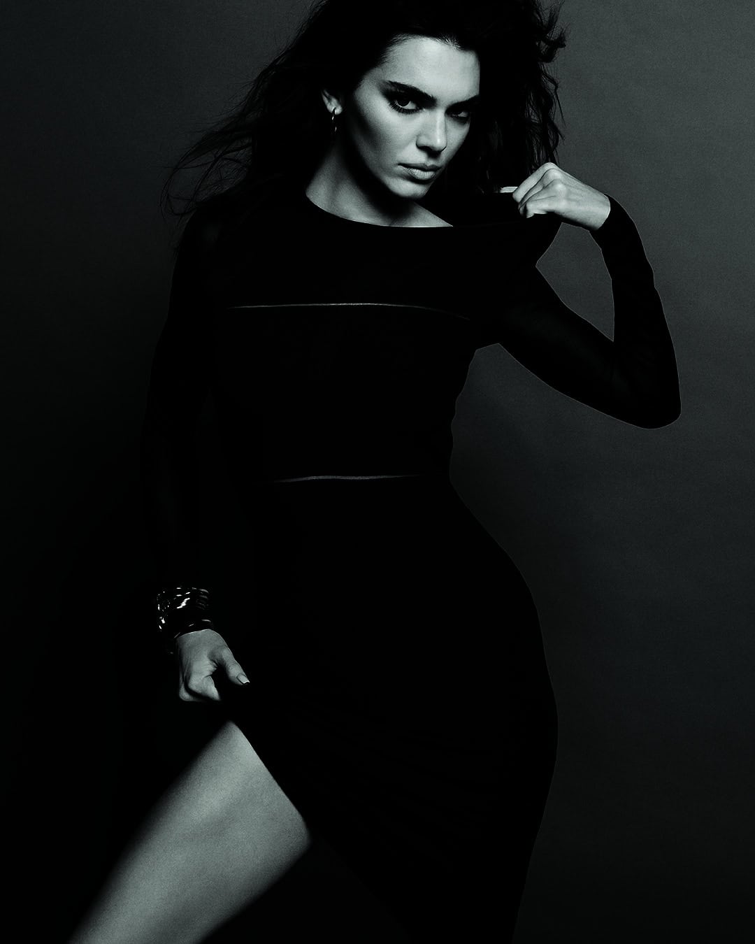 Kendall Jenner wearing a long black dress for Calvin Klein Fall 2023 ad campaign, photographed in monochrome by Inez & Vinoodh.