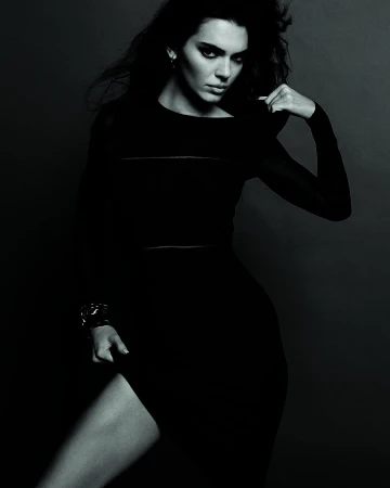 Kendall Jenner wearing a long black dress for Calvin Klein Fall 2023 ad campaign, photographed in monochrome by Inez & Vinoodh.