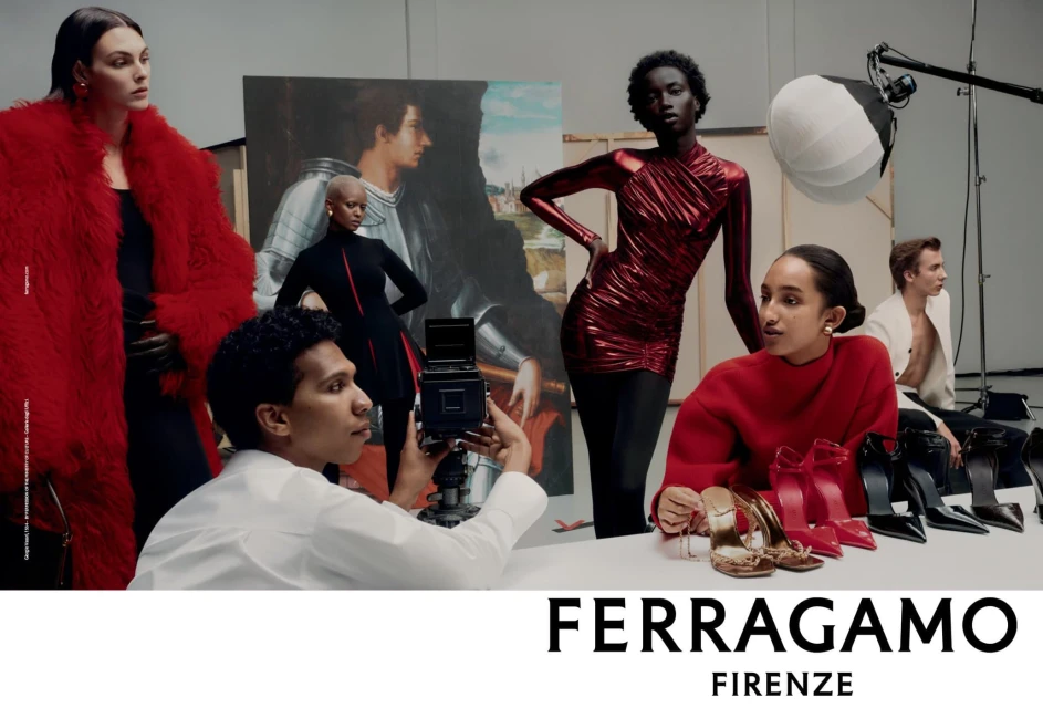 Fashion editorial featuring diverse models in a studio with red and metallic clothing, shoes, and a photographer with vintage camera equipment.