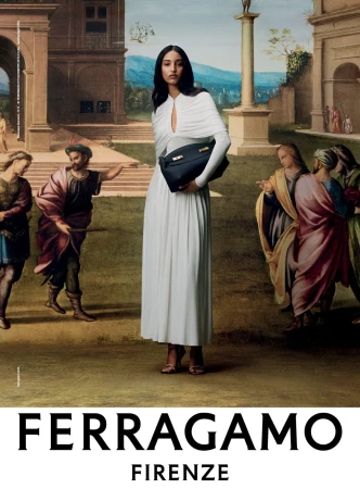 Elegant brunette woman in a white dress holds a black handbag in front of a Renaissance-style painting, fashion advertisement.