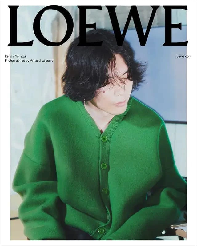 Kenshi Yonezu wearing a vibrant green textured cardigan for Loewe Fall 2023 Japan Men's Campaign shot by photographer Arnaud Lajeunie.