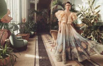 Model Vivienne Rohner in an ornate ruffled gown for Zimmermann Fall 2023 campaign inside a sunlit Parisian conservatory.