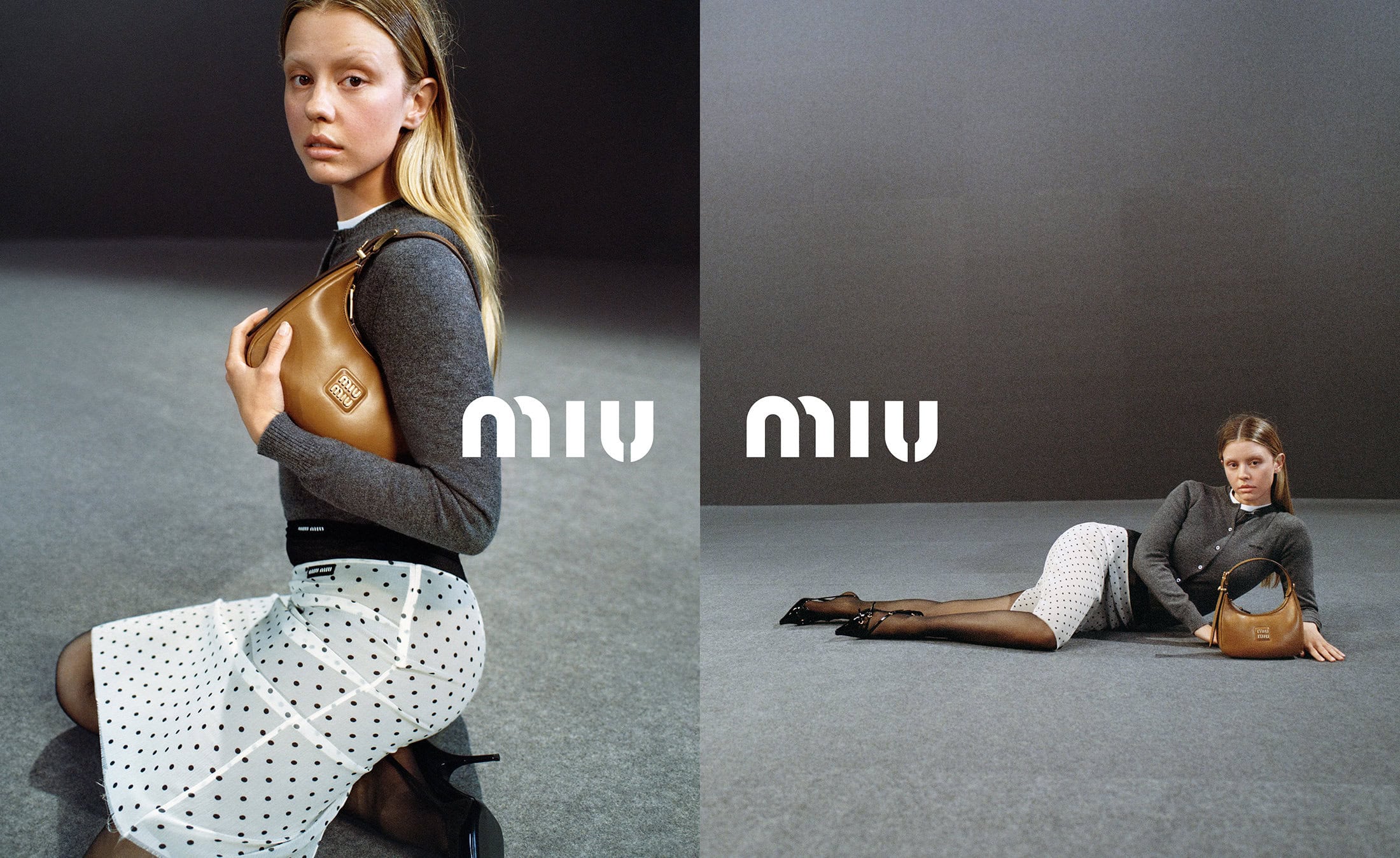 Fashion shot of a woman kneeling while holding a handbag in a studio setting, showcasing a polka dot skirt and logo backdrop.