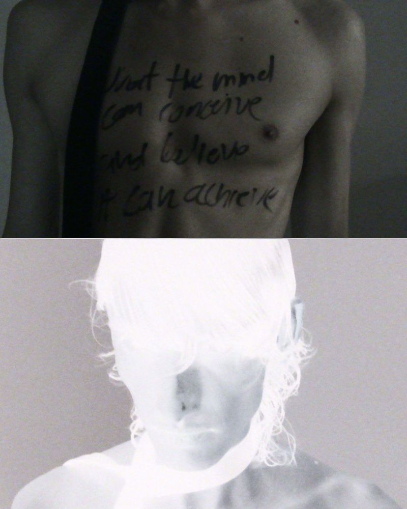 Split image of a person's torso with writing and an inverted face, featuring unique contrast and artistic expression.
