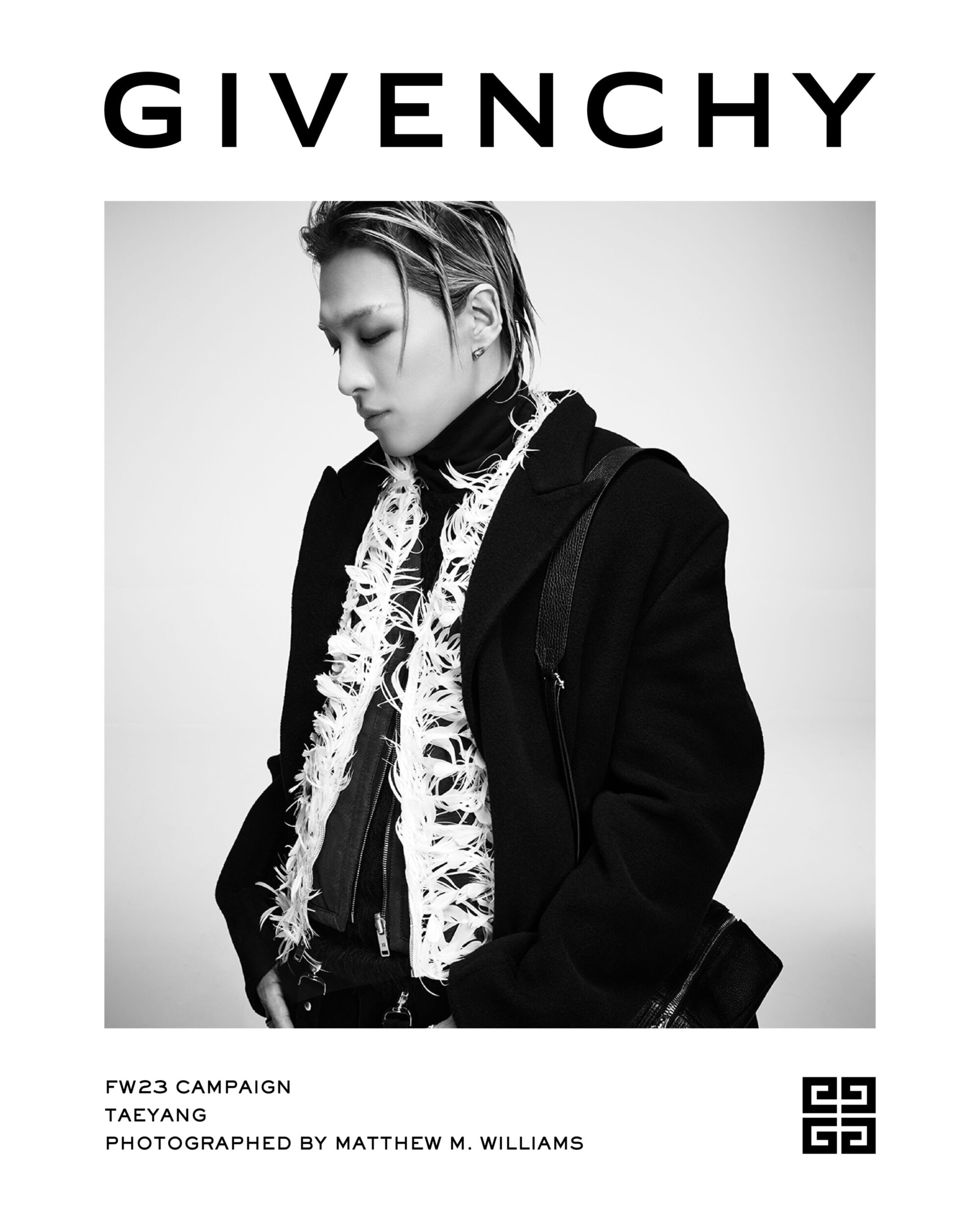 Black and white portrait of a young adult male model wearing a black coat with fringed detailing, featured in a Givenchy fashion campaign.