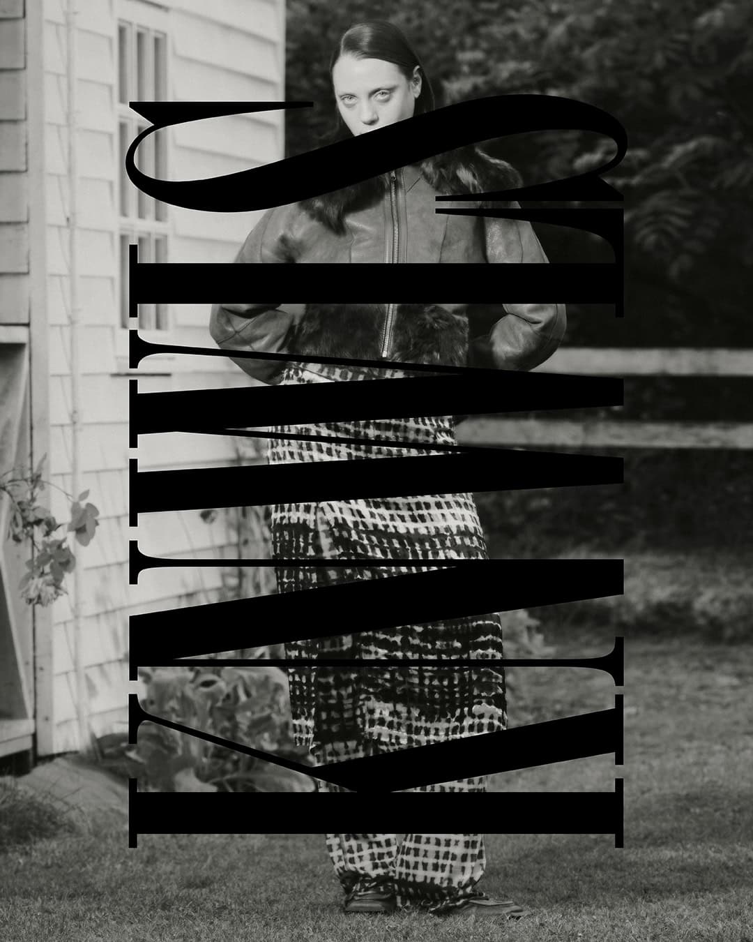 Monochrome portrait of a slim adult woman in an outdoor setting wearing a jacket and patterned pants, with large black text overlay.