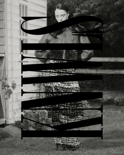 Monochrome portrait of a slim adult woman in an outdoor setting wearing a jacket and patterned pants, with large black text overlay.