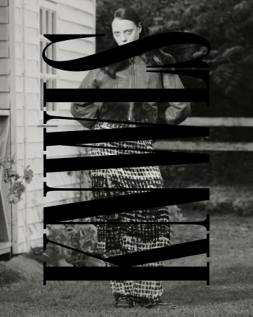 Monochrome portrait of a slim adult woman in an outdoor setting wearing a jacket and patterned pants, with large black text overlay.