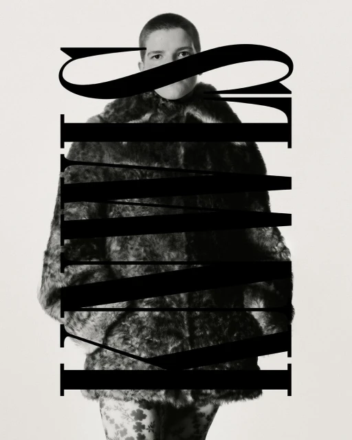 A person in a fur coat poses indoors with a serious expression, with text overlay in black and white.
