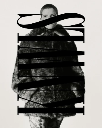 A person in a fur coat poses indoors with a serious expression, with text overlay in black and white.