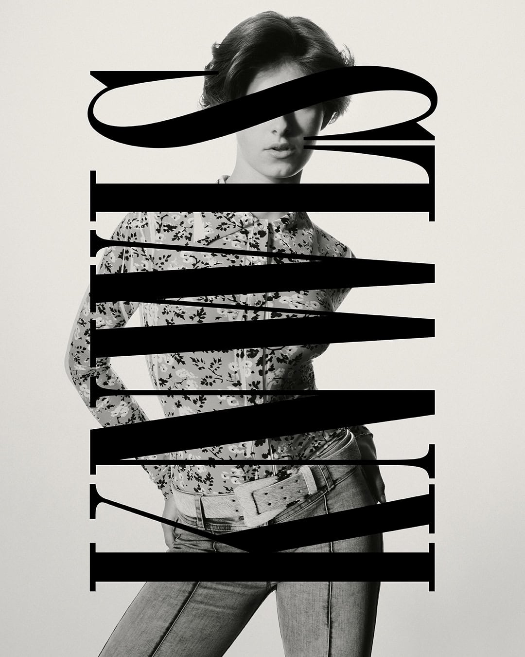 Monochrome fashion portrait of a brunette woman wearing a patterned blouse and blue jeans, featuring bold typography overlay in black.