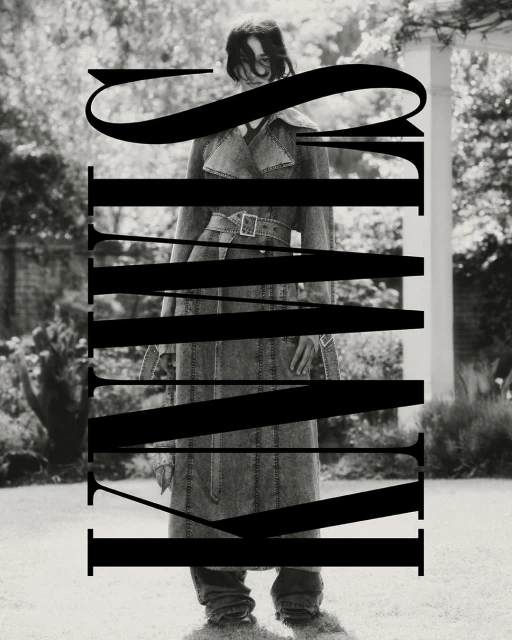 Monochrome portrait of a woman in a denim trench coat posing outdoors with bold typography overlaying the image, editorial fashion.