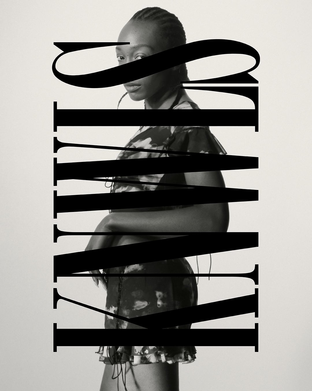 Portrait of a woman in a dress, partially obscured by bold black typography, against a plain off-white background, medium framing.