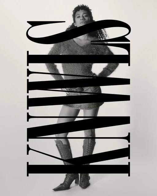 Black and white fashion photograph of a woman in a mini skirt and boots, posed against a light background and obscured by bold typography.