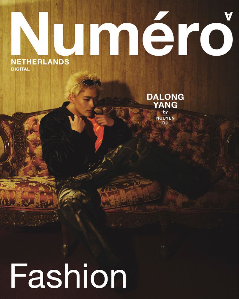 Magazine cover featuring Dalong Yang, photographed by Nguyen Du for Numéro Netherlands Digital, showcased with a vintage couch.
