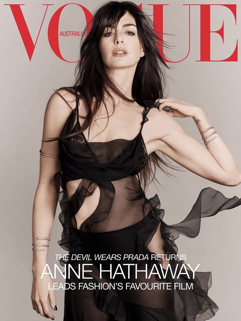 Vogue Australia cover featuring Anne Hathaway, in a semi-sheer black dress, against a neutral background, captured in a fashion photography style.