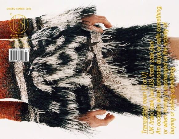 Fashion magazine cover featuring a model wearing a fringed garment with text overlay and Spring-Summer 2026 title, on a clean background.