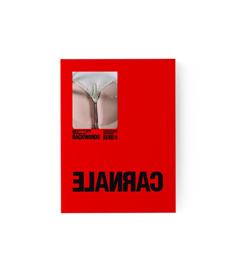 Close-up studio shot of a red album cover featuring a woman's bottom in white bikini bottoms with a zipper, and stylized black text.