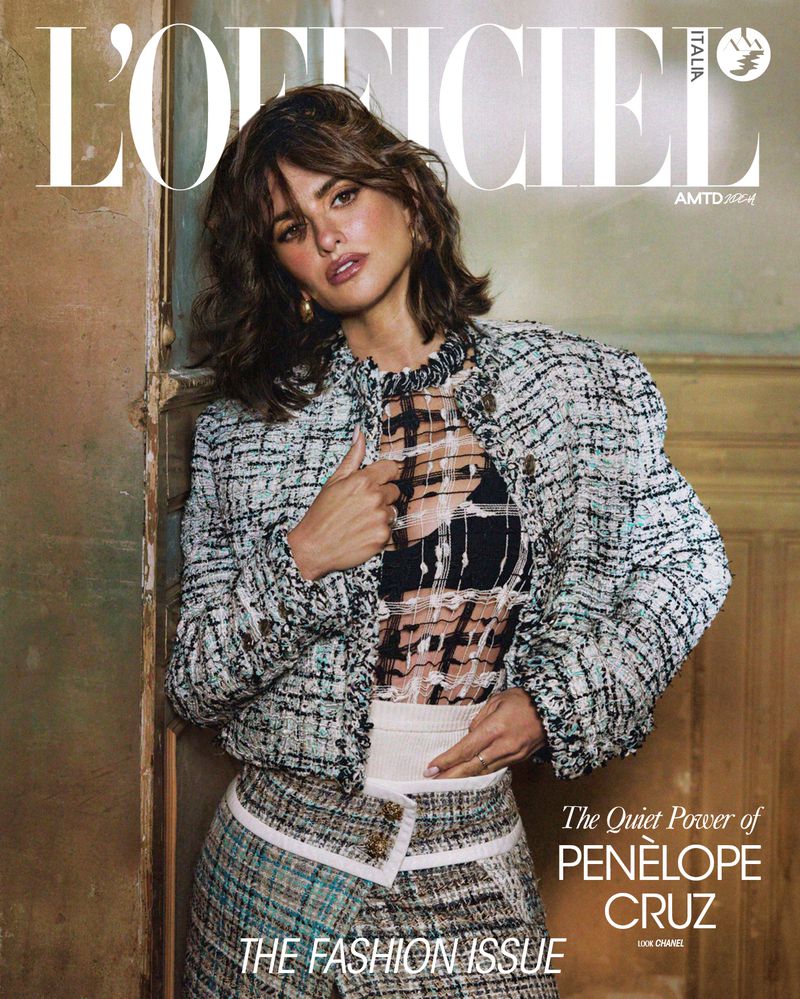 Penelope Cruz graces a magazine cover; she's wearing a tweed jacket, statement earrings, and a layered semi-sheer top, against a neutral backdrop.