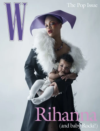 Rihanna cradles baby Rocki on a W Magazine cover. Rihanna wears a black coat, white fur stole, and purple hat. Baby wears white socks.