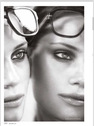 Black and white close up portrait of two female models wearing dark acetate eyewear on their foreheads for Elle Arabia.