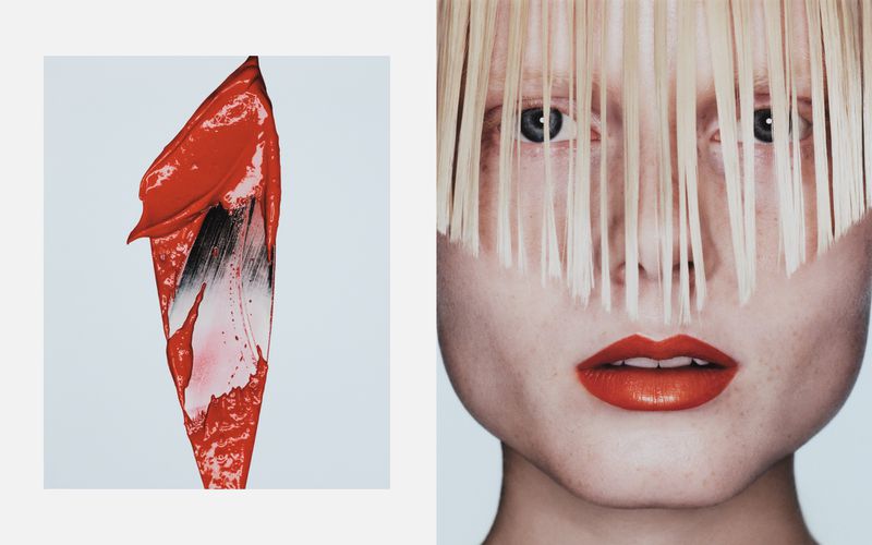 Close-up of a woman's face with bright red lipstick, partially obscured by blonde hair, next to a smear of matching lipstick.