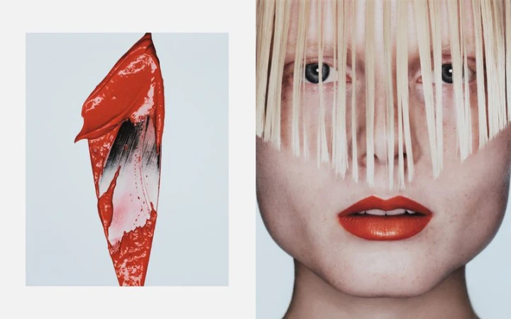 Close-up of a woman's face with bright red lipstick, partially obscured by blonde hair, next to a smear of matching lipstick.