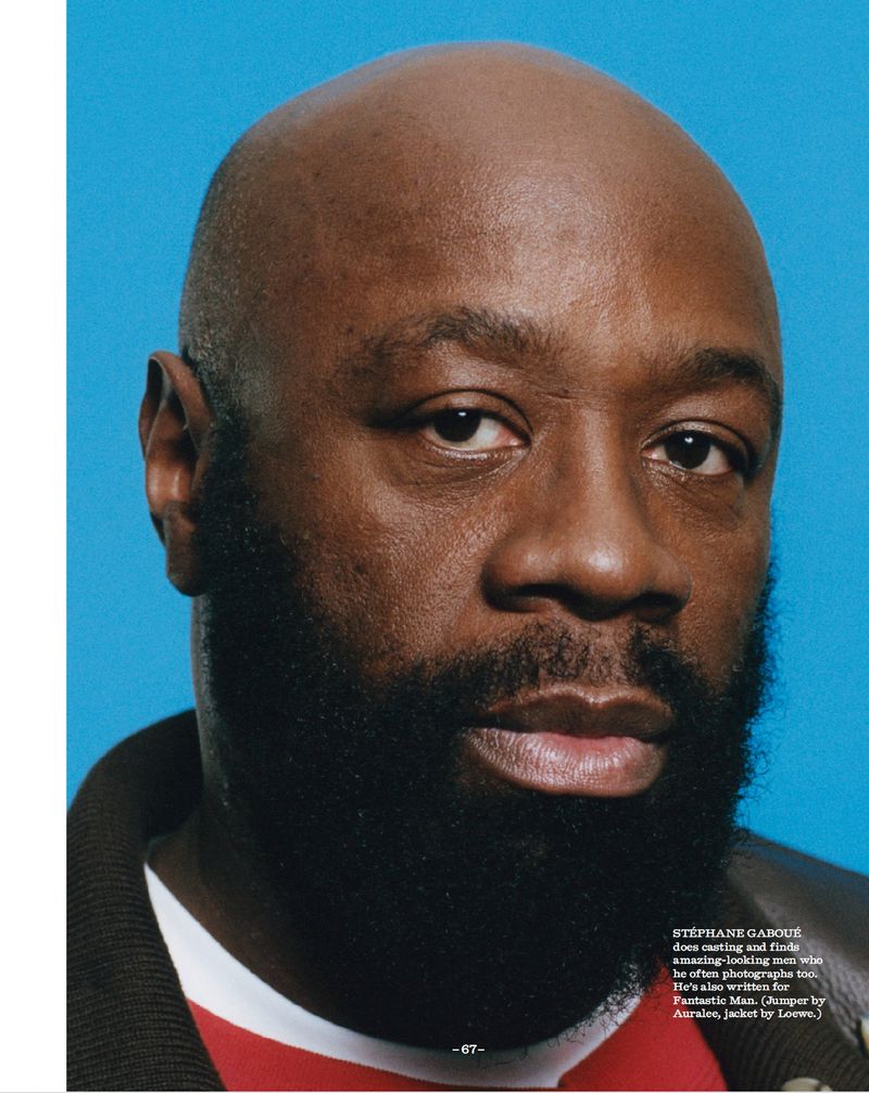 Close-up portrait of a black man with a full beard against a bright blue background for Fantastic Man.