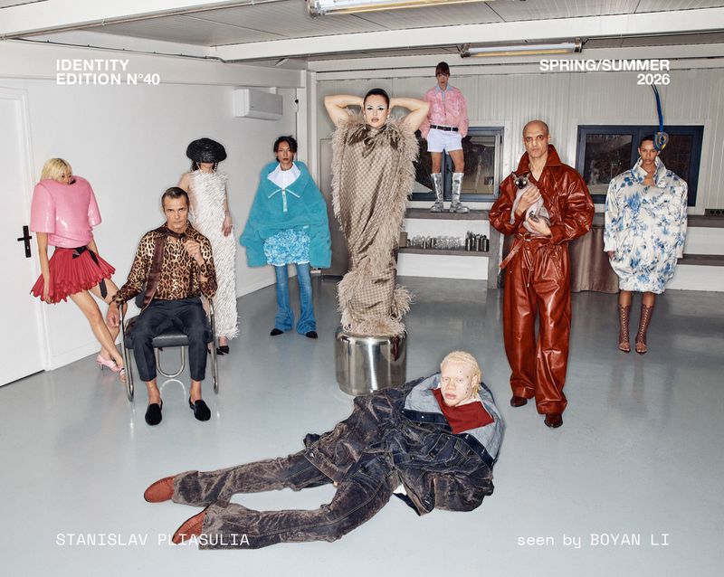Editorial fashion shot featuring a diverse group of models in various poses and outfits, set in a minimalist indoor environment with text overlays.