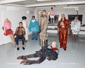 A group of models posing in avant-garde, oversized fashion inside a studio setting for Le Mile Magazine Identity 40.
