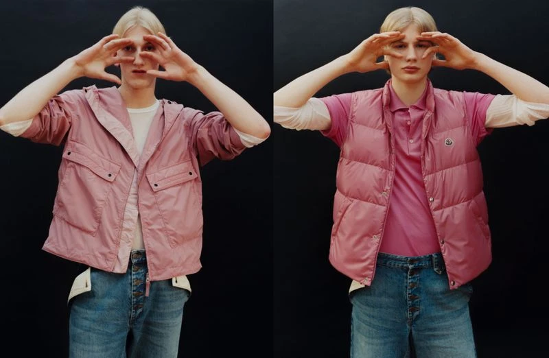 Two images of a light-skinned male model with blonde hair wearing a pink hooded jacket and a pink vest and blue jeans making a frame with his hands.