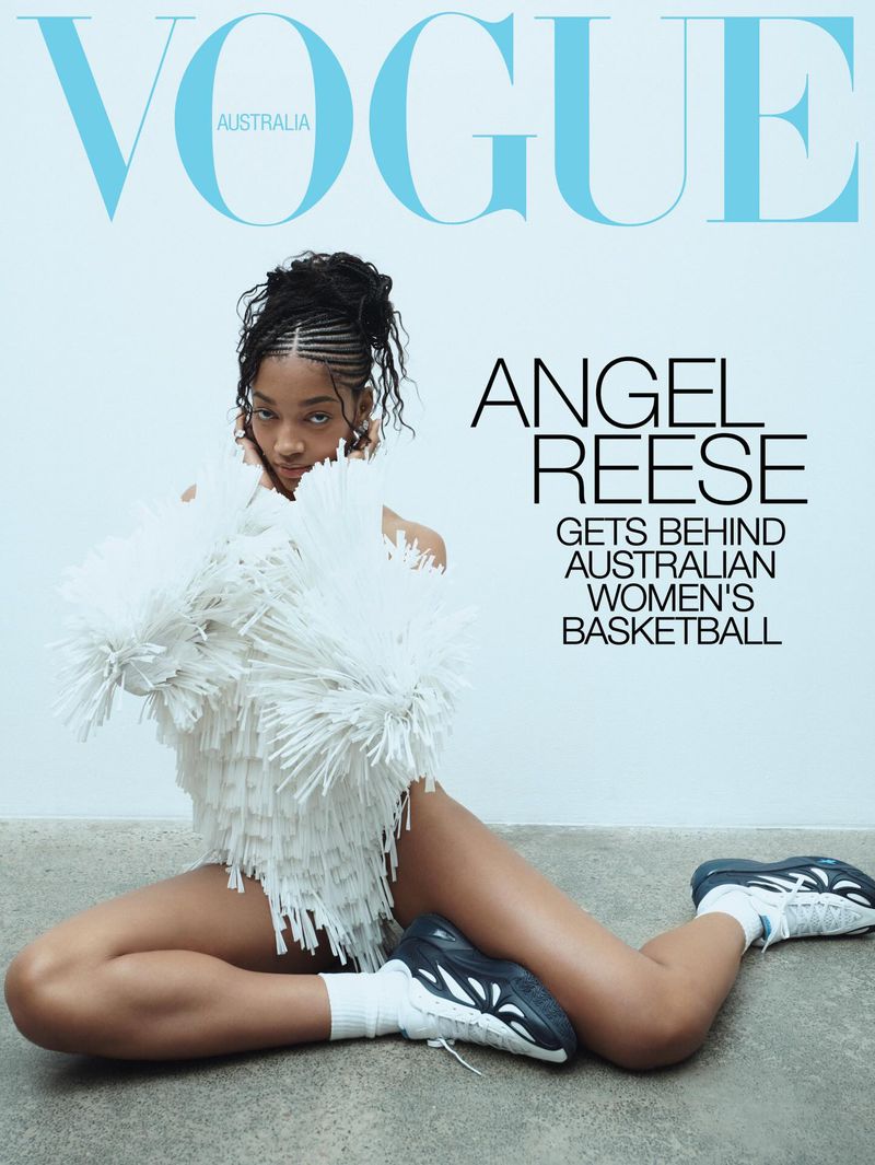 Vogue Australia cover featuring Angel Reese in a white fringe dress, white socks, and sneakers, posing against a neutral background.