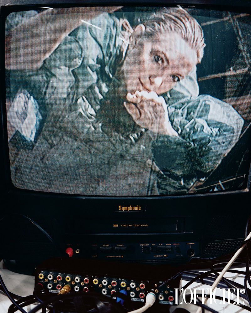 Woman in green scrubs on an old television screen with RCA cables, capturing a blend of retro technology and medical themes.
