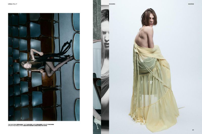 Fashion editorial shot of an adult model in a draped beige gown sitting in a white space and a model sitting in rows of blue seats.