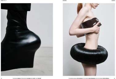 Magazine editorial spread showing a sculptural black wedge heel alongside a model wearing an avant-garde circular structured skirt.