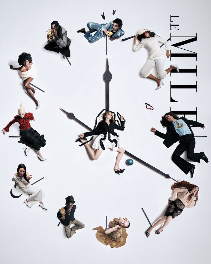 Overhead view of models arranged on a clock face with hands indicating different hours, wearing elegant clothing, against a white backdrop.