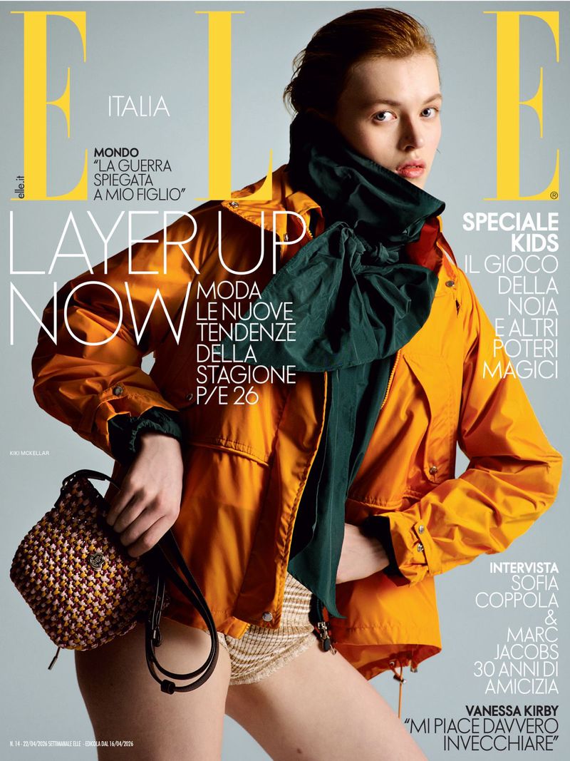 Elle Italia cover featuring an adult female model in an orange jacket, holding a small woven purse with the Elle logo and cover text.