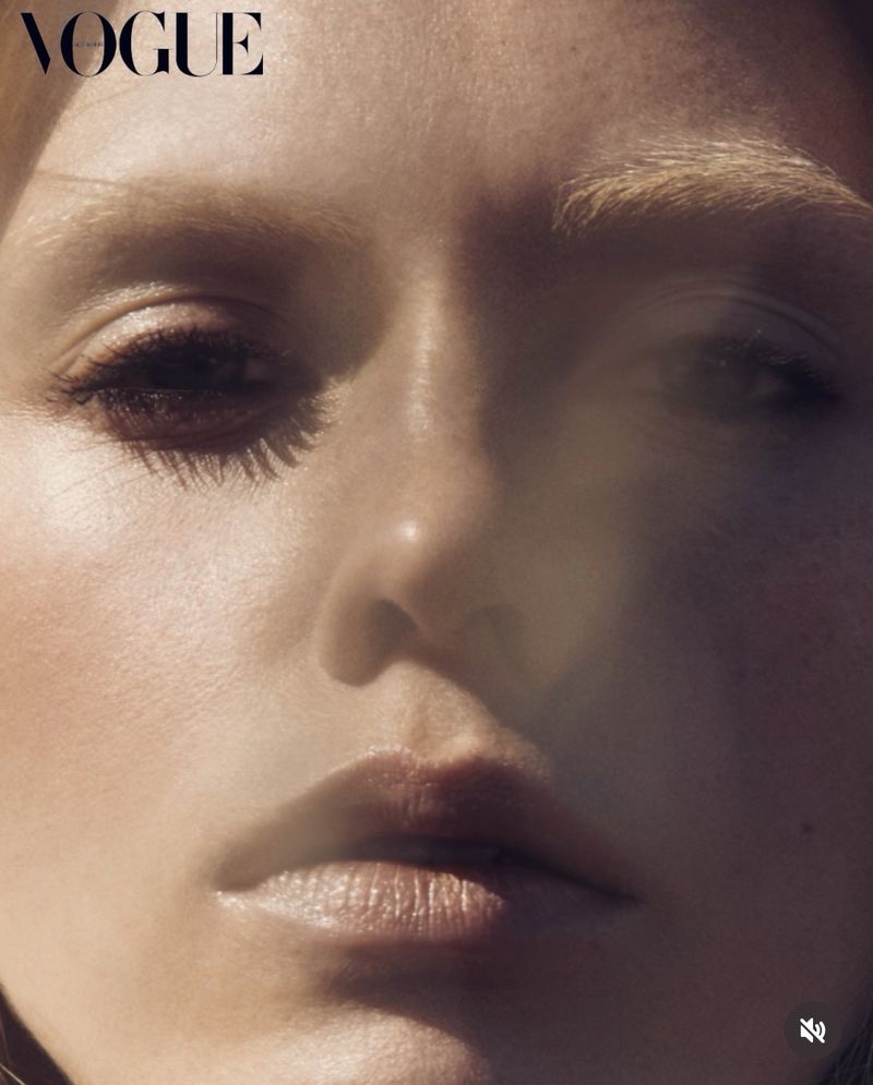Close-up beauty portrait of model Charlotte Nolting with bleached eyebrows in warm natural sunlight for Vogue Australia.