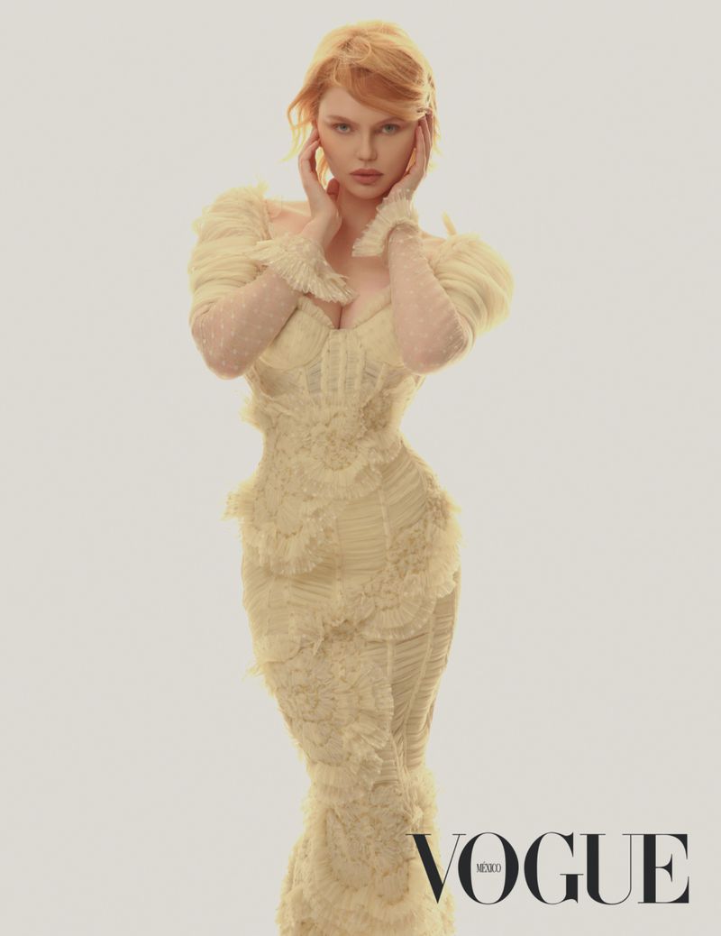Model Elena Matei in a pale yellow textured ruffle gown with hands near her face against a warm studio backdrop for Vogue Mexico.