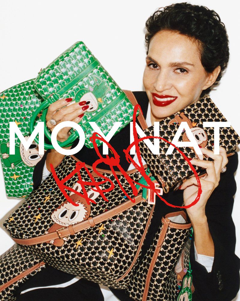 Farida Khelfa holds green and black patterned Moynat handbags from the Kasing Lung collection against a white studio background.