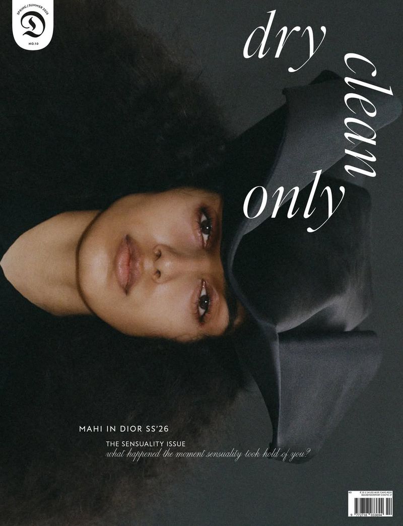 Model Mahi Kabra wearing a black sculptural headpiece and voluminous hair on the cover of Dry Clean Only Magazine.